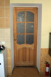 wooden kitchen door with fire extinguisher